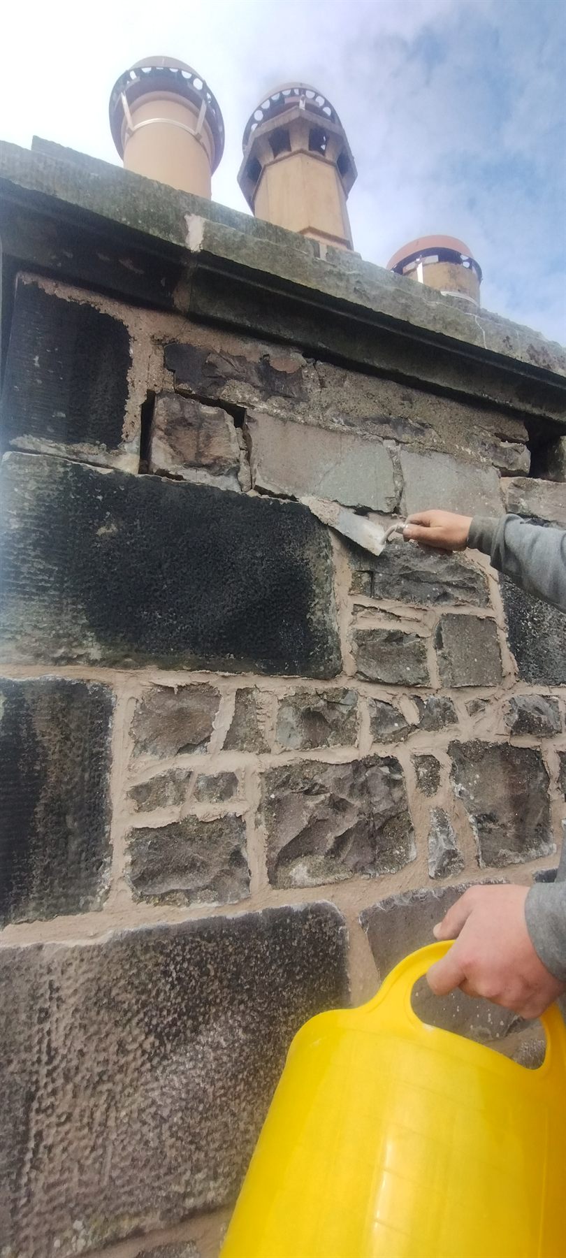 Chimney head raked out and repointed by hand, pots left sound and sitting true.